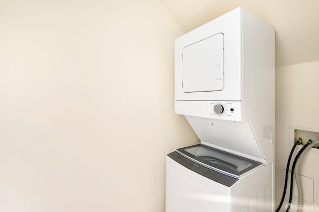 laundry room featuring stacked washer and dryer