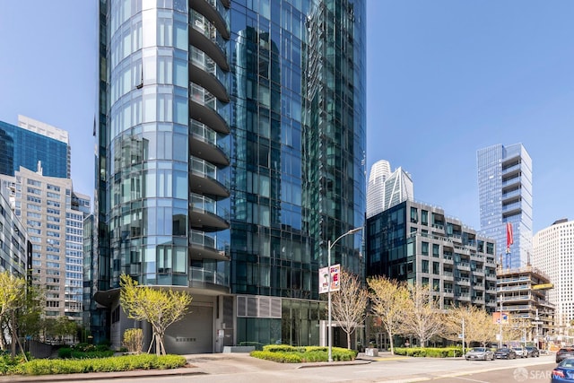 view of building exterior with a city view and a garage