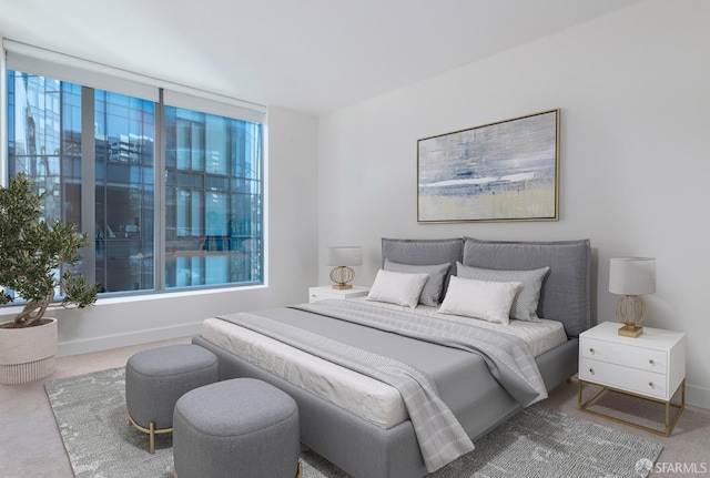 bedroom with carpet flooring and baseboards