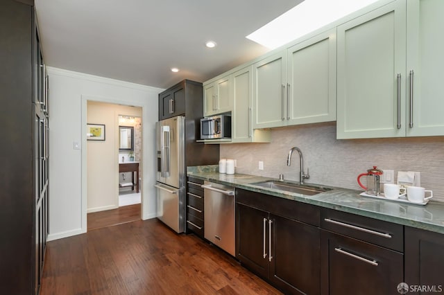 117 Meadowbrook Dr, San Francisco, CA 94132 - kitchen featuring stainless steel appliances, stone countertops, backsplash, dark wood finished floors, and recessed lighting