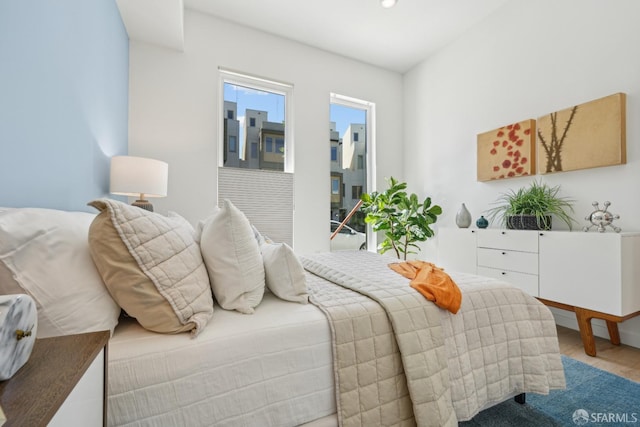 bedroom featuring wood finished floors and recessed lighting