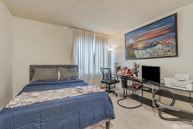 carpeted bedroom with a textured ceiling