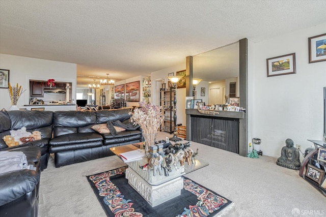 carpeted living room with a textured ceiling and an inviting chandelier