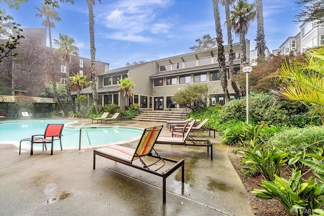 view of swimming pool featuring a patio area