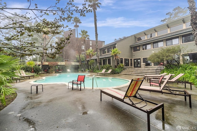 view of pool featuring a patio area