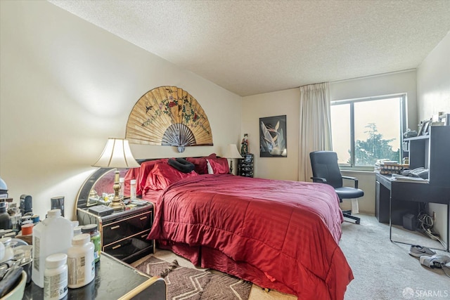 carpeted bedroom featuring a textured ceiling