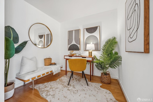 living area with hardwood / wood-style flooring