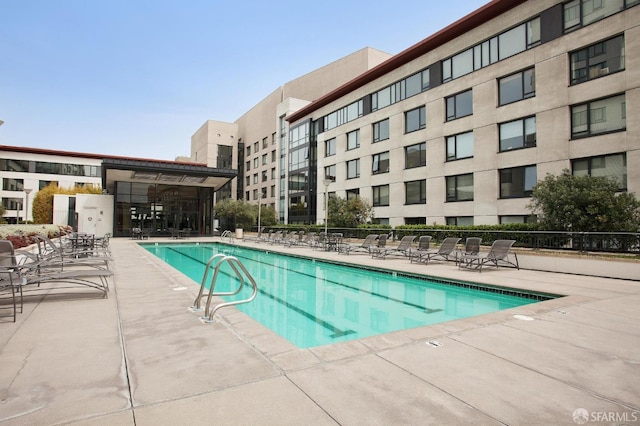 view of pool featuring a patio area