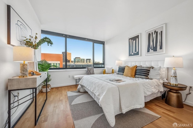 bedroom with light hardwood / wood-style flooring