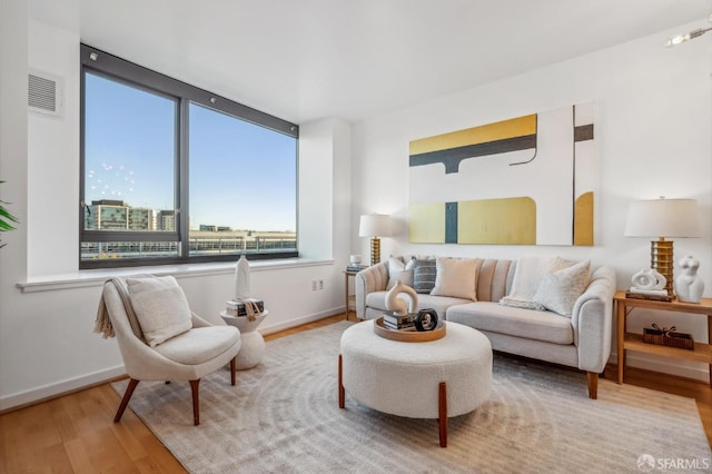 sitting room featuring hardwood / wood-style flooring