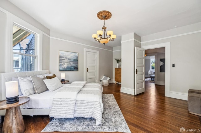 68 Castro St, San Francisco, CA 94114 - bedroom with a chandelier, baseboards, and dark wood-type flooring