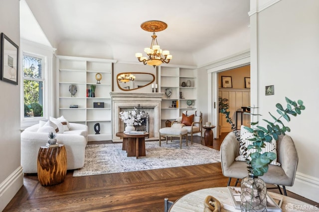 68 Castro St, San Francisco, CA 94114 - living area featuring a chandelier, baseboards, wood finished floors, and a fireplace