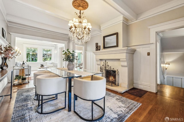 68 Castro St, San Francisco, CA 94114 - dining room featuring a decorative wall, wood finished floors, a lit fireplace, a chandelier, and crown molding
