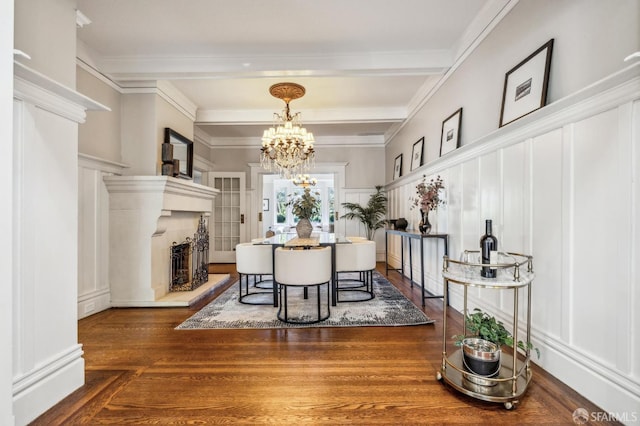 68 Castro St, San Francisco, CA 94114 - dining area with a decorative wall, a fireplace with raised hearth, beam ceiling, a chandelier, and ornamental molding