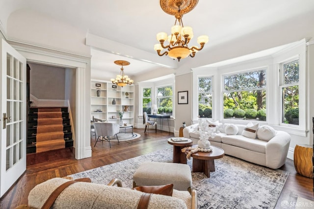 68 Castro St, San Francisco, CA 94114 - living room featuring a chandelier, wood finished floors, stairs, and baseboards
