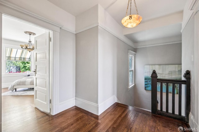 68 Castro St, San Francisco, CA 94114 - foyer entrance featuring wood finished floors, a chandelier, and baseboards