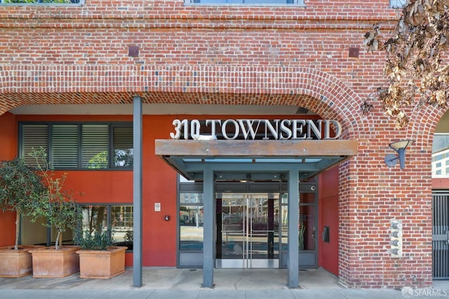 entrance to property with brick siding