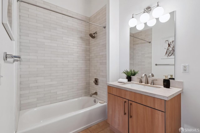 full bathroom featuring washtub / shower combination, vanity, and tile patterned floors