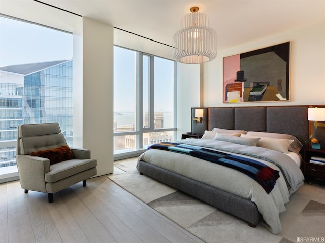 181 Fremont St Unit 65C, San Francisco, CA 94105 - bedroom featuring wood finished floors and floor to ceiling windows