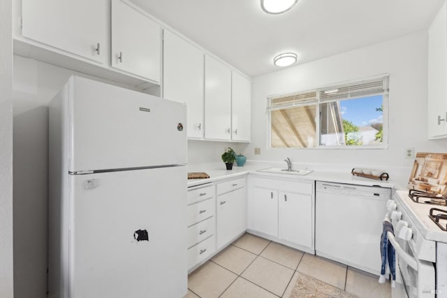 355 Parkview Ter Unit A6, Vallejo, CA 94589 - kitchen featuring a sink, light countertops, white cabinets, light tile patterned floors, and white appliances