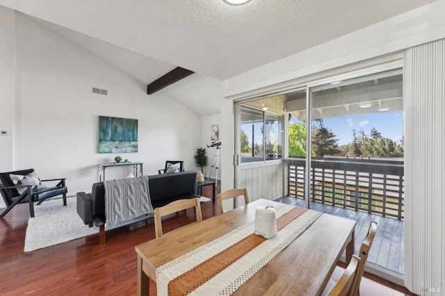 355 Parkview Ter Unit A6, Vallejo, CA 94589 - dining area featuring a textured ceiling, vaulted ceiling, wood finished floors, and visible vents