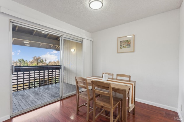 355 Parkview Ter Unit A6, Vallejo, CA 94589 - dining room featuring baseboards, a textured ceiling, and wood finished floors