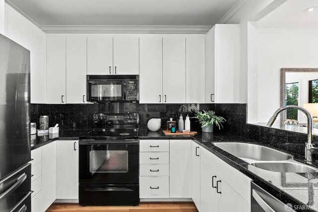 536 Wisconsin St, San Francisco, CA 94107 - kitchen with black appliances, white cabinets, tasteful backsplash, dark stone counters, and crown molding
