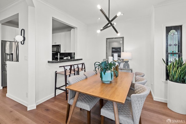 536 Wisconsin St, San Francisco, CA 94107 - dining space with ornamental molding, wood finished floors, and a chandelier
