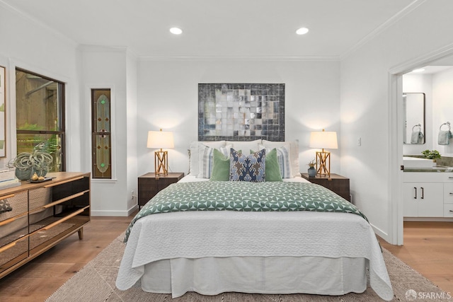 536 Wisconsin St, San Francisco, CA 94107 - bedroom featuring wood finished floors, crown molding, recessed lighting, and ensuite bath