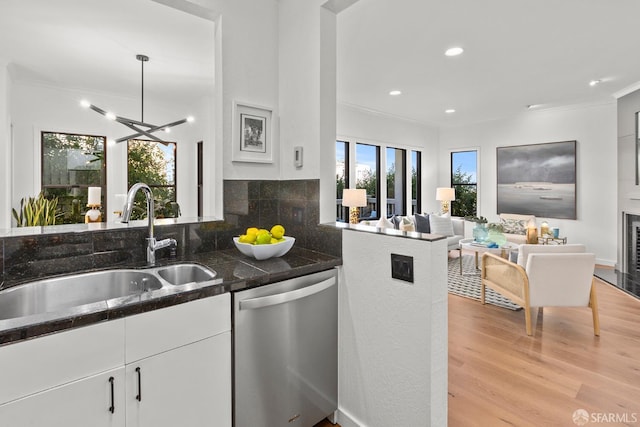 536 Wisconsin St, San Francisco, CA 94107 - kitchen with stainless steel dishwasher, ornamental molding, open floor plan, white cabinets, and light wood finished floors