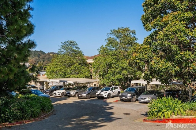 view of partially covered parking lot