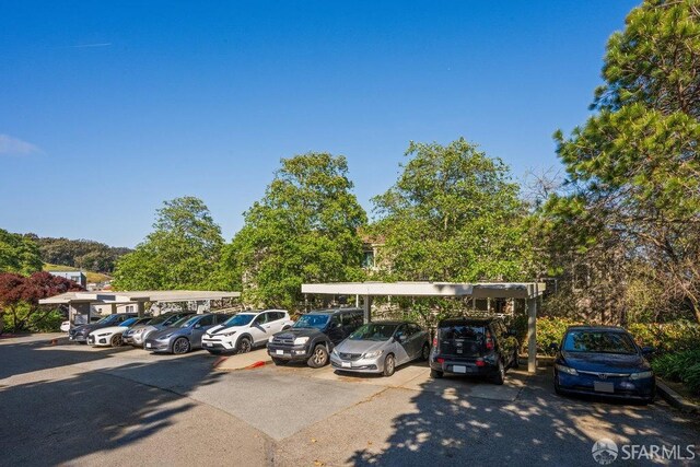 view of partially covered parking lot