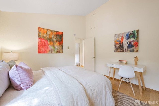 bedroom featuring high vaulted ceiling