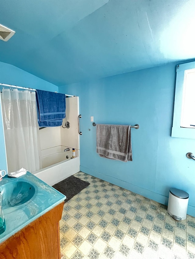 bathroom with vanity and shower / bathtub combination with curtain