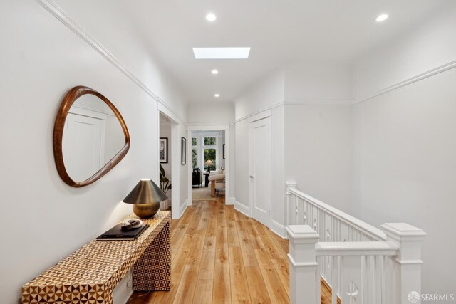 1982 Fell St, San Francisco, CA 94117 - hallway featuring an upstairs landing, recessed lighting, light wood-style floors, and a skylight