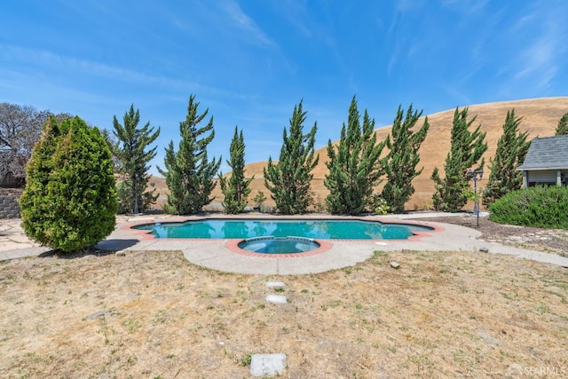 5317 Judsonville Dr, Antioch, CA 94531 - view of swimming pool with a pool with connected hot tub and a fenced backyard