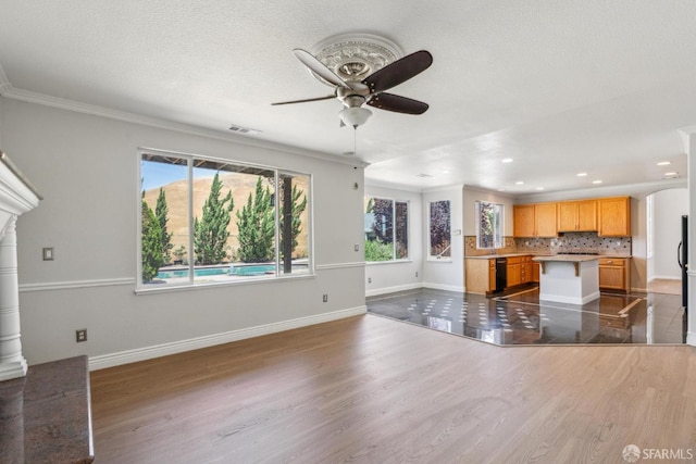 5317 Judsonville Dr, Antioch, CA 94531 - unfurnished living room featuring ceiling fan, plenty of natural light, crown molding, dark wood-style flooring, and recessed lighting