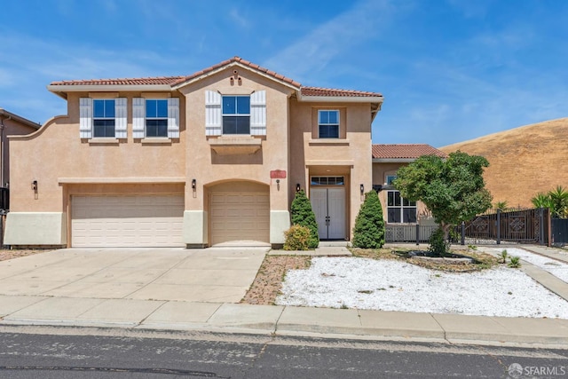 5317 Judsonville Dr, Antioch, CA 94531 - view of front of home featuring a tile roof, stucco siding, a garage, and driveway
