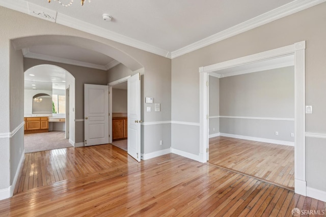 5317 Judsonville Dr, Antioch, CA 94531 - spare room featuring light wood finished floors, arched walkways, crown molding, baseboards, and a smoke detector