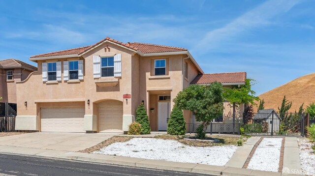 5317 Judsonville Dr, Antioch, CA 94531 - view of front of property featuring stucco siding, a garage, a tiled roof, fence, and driveway
