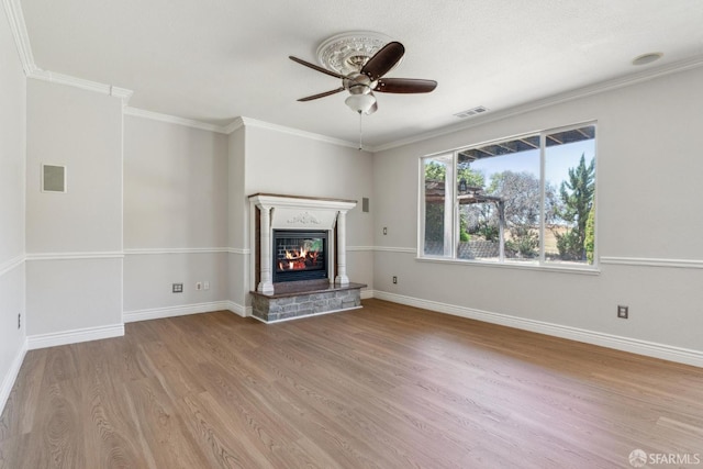 5317 Judsonville Dr, Antioch, CA 94531 - unfurnished living room featuring wood finished floors, a ceiling fan, a glass covered fireplace, ornamental molding, and baseboards