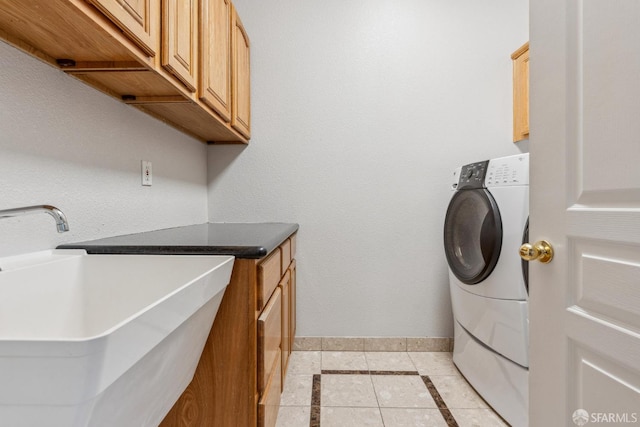 5317 Judsonville Dr, Antioch, CA 94531 - clothes washing area featuring cabinet space, baseboards, light tile patterned floors, washer / dryer, and inlaid floor details