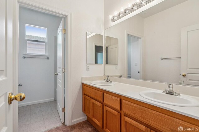 5317 Judsonville Dr, Antioch, CA 94531 - bathroom featuring double vanity, baseboards, and tile patterned floors