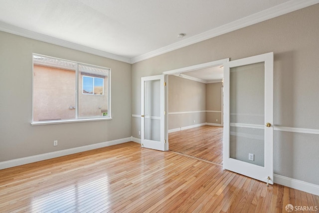5317 Judsonville Dr, Antioch, CA 94531 - empty room featuring french doors, crown molding, wood-type flooring, and baseboards