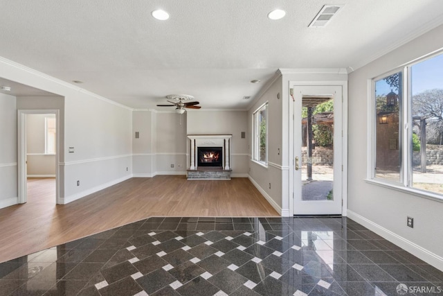 5317 Judsonville Dr, Antioch, CA 94531 - unfurnished living room with granite tiled floors, baseboards, a lit fireplace, ceiling fan, and crown molding