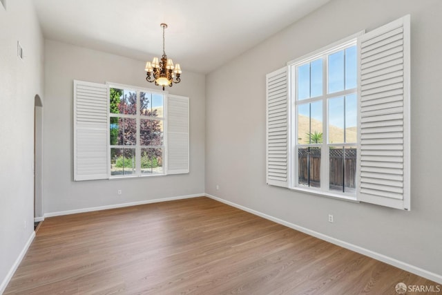 5317 Judsonville Dr, Antioch, CA 94531 - unfurnished room featuring baseboards, a chandelier, and wood finished floors