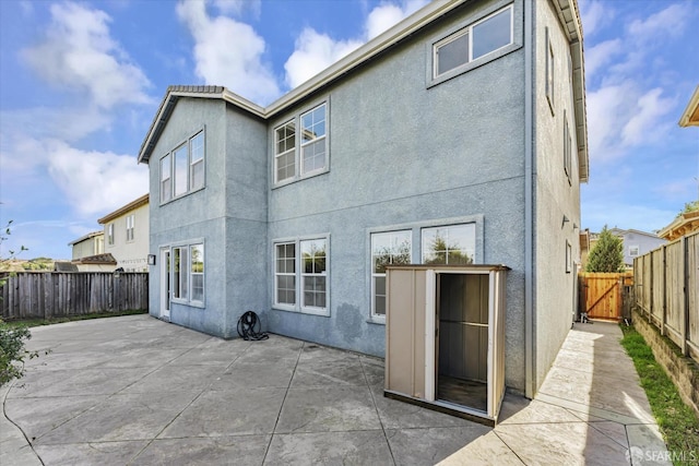 back of house featuring a patio