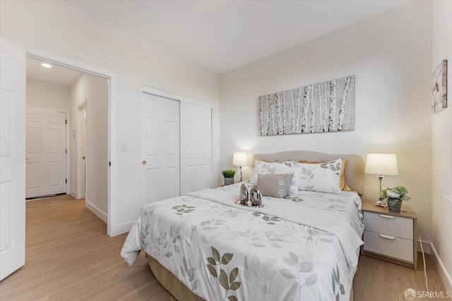 bedroom featuring a closet and light hardwood / wood-style floors