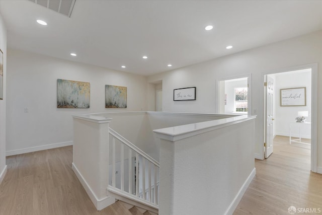 hall with light wood-type flooring