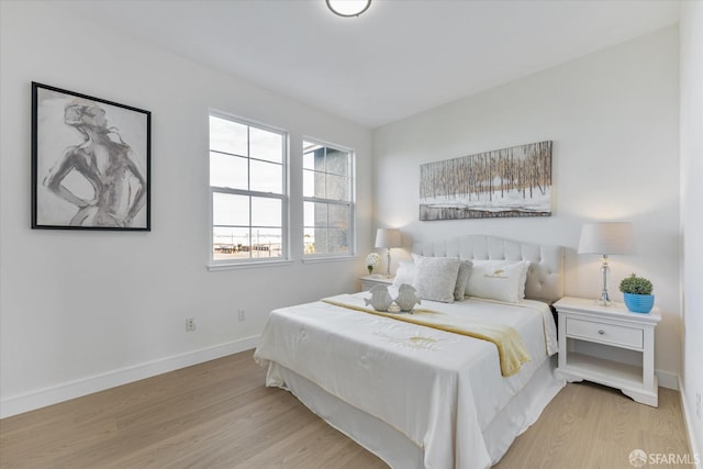 bedroom with light wood-type flooring